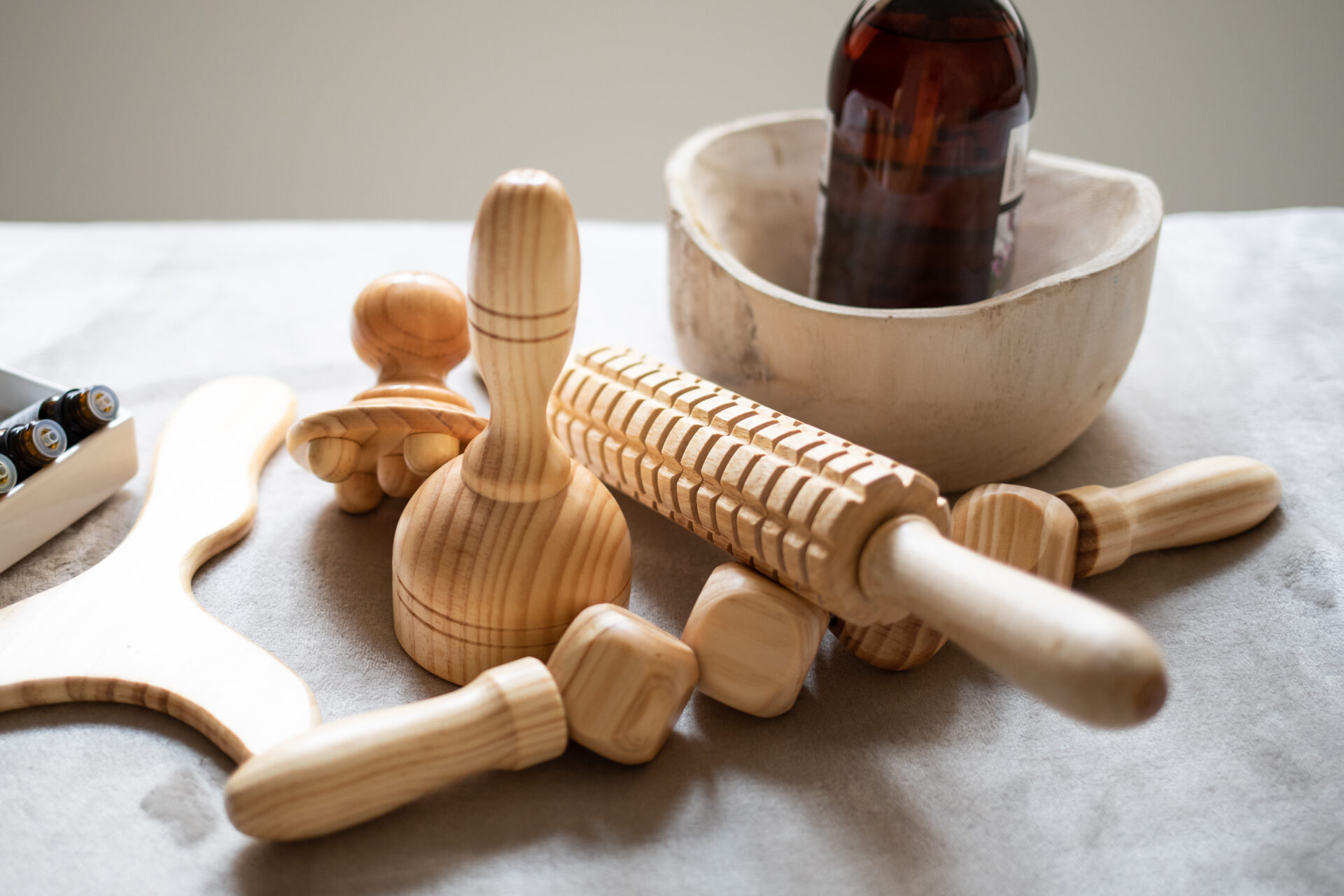 Wood therapy instruments on massage table
